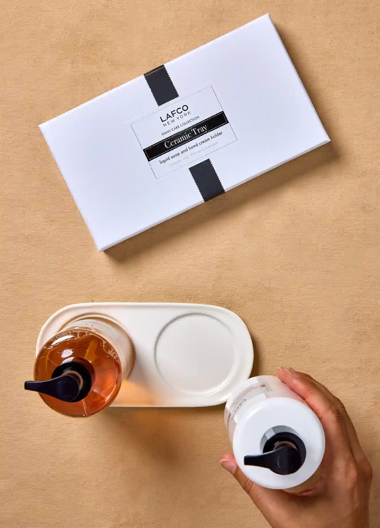 Ceramic tray with packaging on a wooden surface